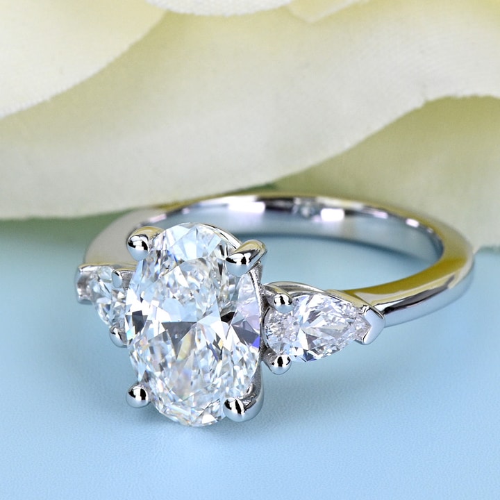 The Quintessence of Elegance: Oval Diamond with Pear Side Stones The Quintessence of Elegance: Oval Diamond with Pear Side Stones