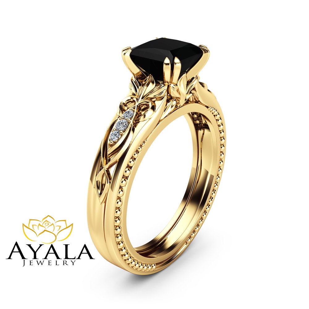 the-enigmatic-union-black-diamond-yellow-gold-engagement-rings